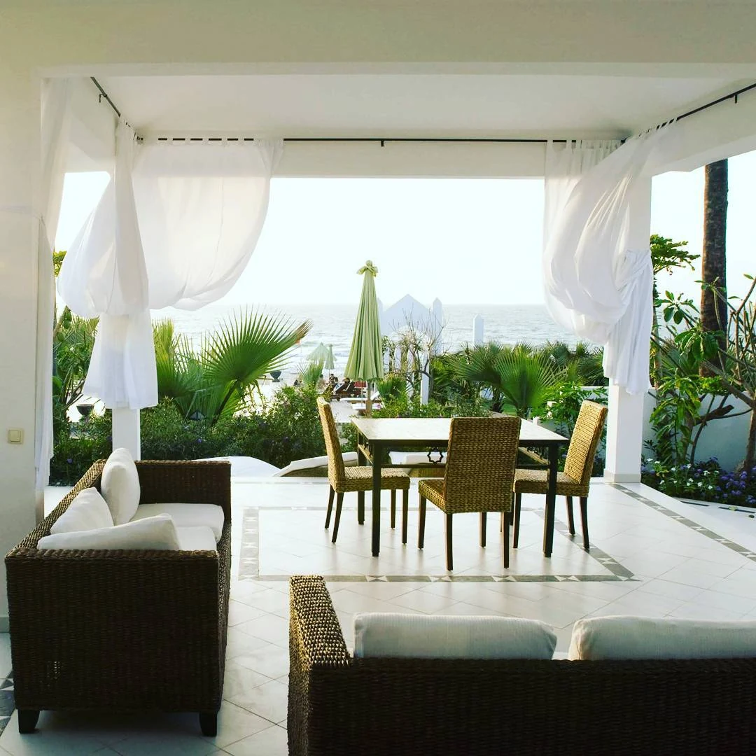 Coco Ocean suite private terrace with white canopy and ocean view
