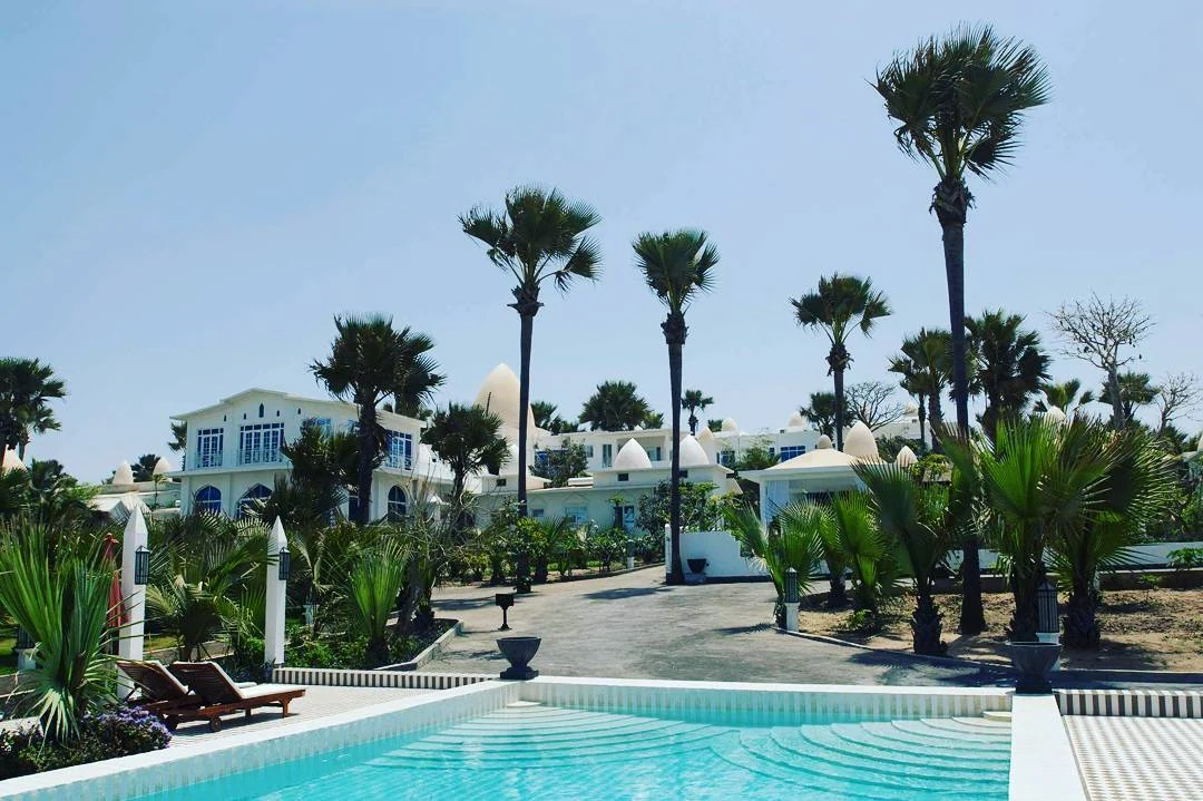 Pool exterior with palms